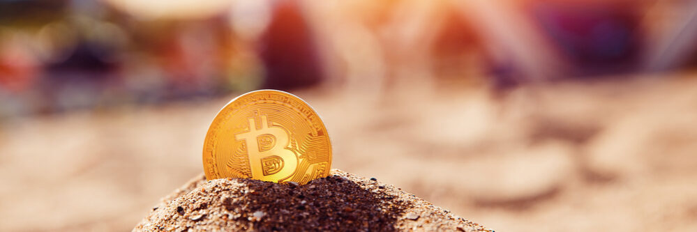 Bitcoin,On,Golden,Sand,,In,Background,Sea.,Concept,Freelance,,Stock