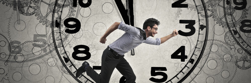 Businessman,In,Suit,Running,On,Time