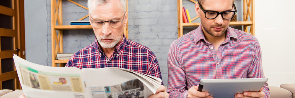 Old,Father,Reading,Newspaper,And,His,Son,Using,Tablet